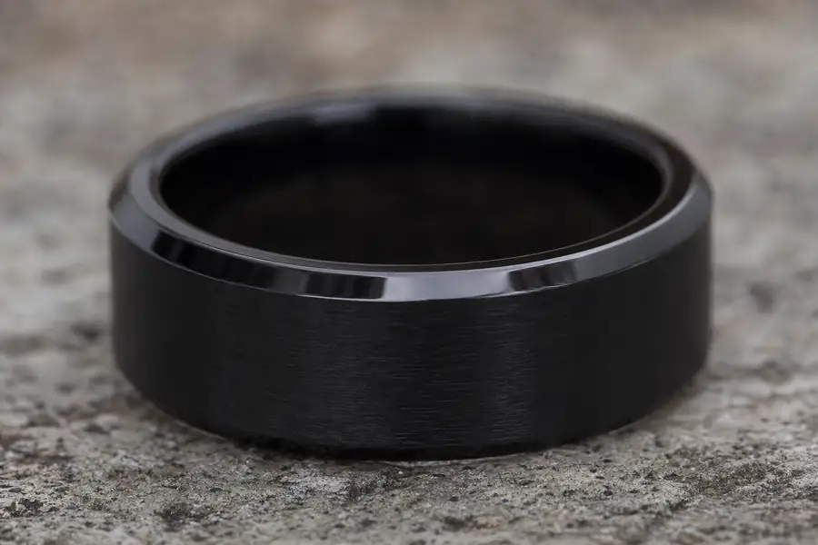 A black band with a polished bevel catching light