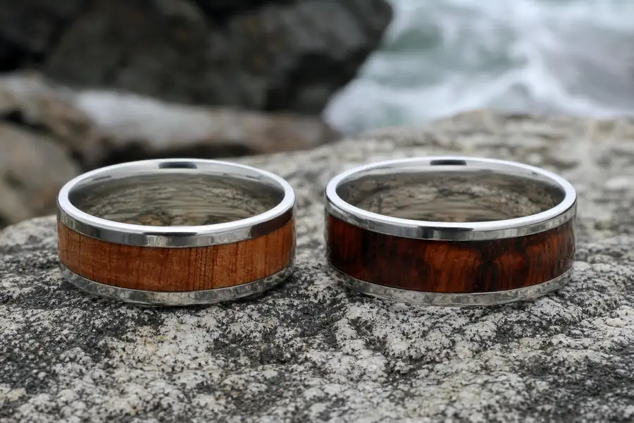 Two koa inlay bands side by side with visibly different grain