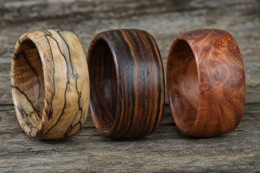Three wood inlay bands side by side showing different grains