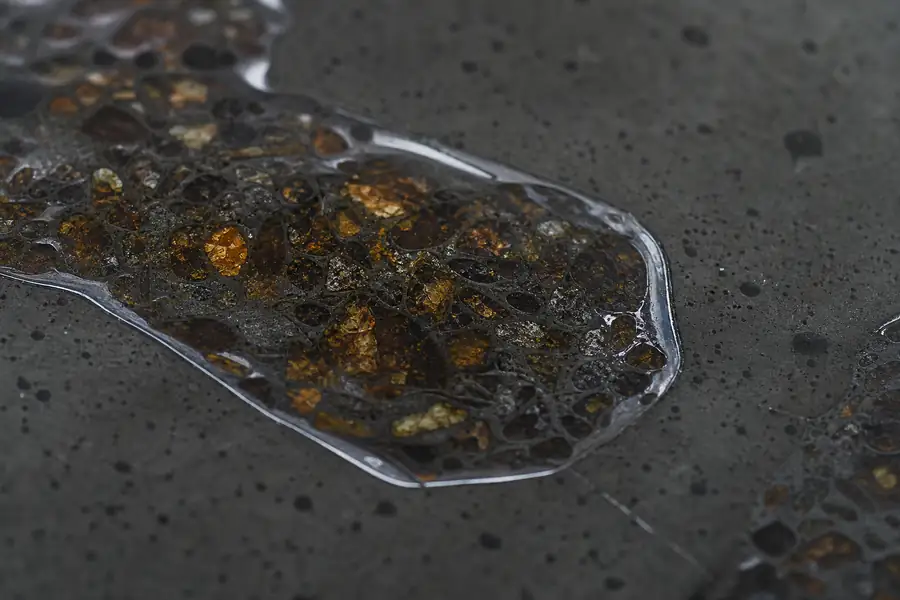 Macro of a sealed meteorite inlay surface